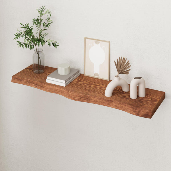 a wooden shelf with various decorative items on it, including a plant, books, and a framed picture.