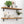 a set of two wooden shelves mounted on a wall, each holding various decorative items and plants. The top shelf has a potted plant, a vase, and a clock, while the bottom shelf has a plant, a book, and a vase. The shelves are well-organized, showcasing a harmonious blend of natural elements and functional items.