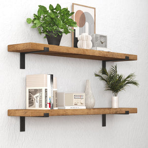 a set of two wooden shelves mounted on a wall, each holding various decorative items and plants. The top shelf has a potted plant, a vase, and a clock, while the bottom shelf has a plant, a book, and a vase. The shelves are well-organized, showcasing a harmonious blend of natural elements and functional items.