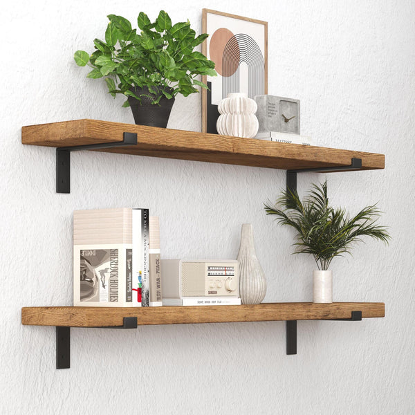 a set of two wooden shelves mounted on a wall, each holding various decorative items and plants. The top shelf has a potted plant, a vase, and a clock, while the bottom shelf has a plant, a book, and a vase. The shelves are well-organized, showcasing a harmonious blend of natural elements and functional items.