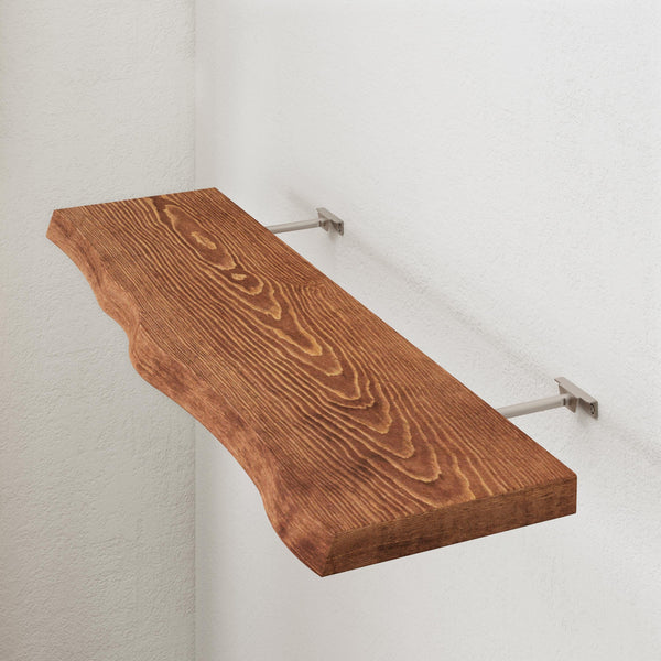 a wooden shelf mounted on a white wall.