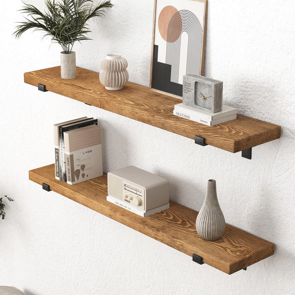 two wooden shelves mounted on a wall, each holding various decorative items such as a plant, a vase, a clock, and a radio.