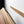a wooden surface with a wooden board mounted on a white wall.