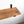 a wooden shelf mounted on a white wall, with a black metal bracket attached to the wall.